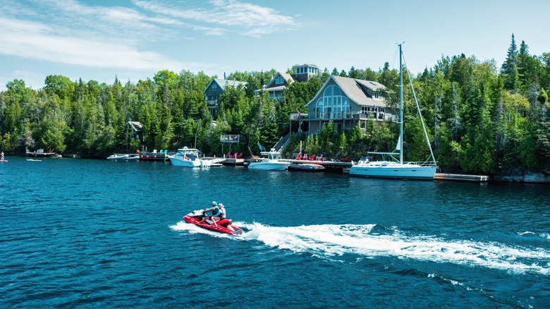 A pair of people on a jetski in Tobermory, Ontario