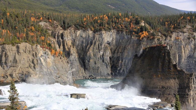 A Canadian national park with raging white water, cliffs, and trees