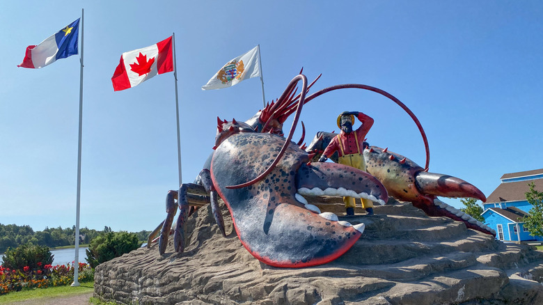 A large lobster and fisherman statue in Shediac, New Brunswick, Canada