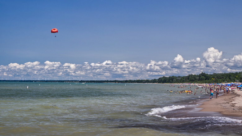 People enjoy the beach at Grand Bend, Ontario, Canada, on a sunny day