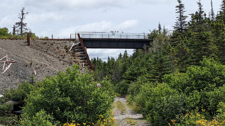 Railway bridge with theme park sign remnants of Trinity Loop in Newfoundland