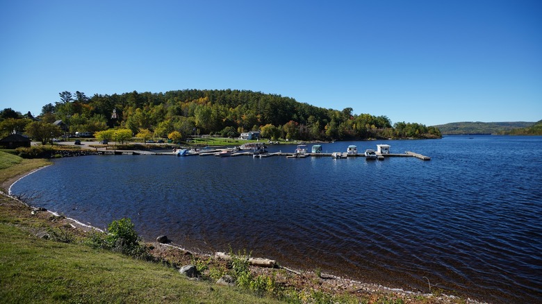 Mattawa's waterfront with small boats and greenery in the background