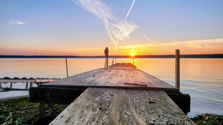 sunset over dock at Childs Lake in Duck Mountain Provincial Park in Manitoba