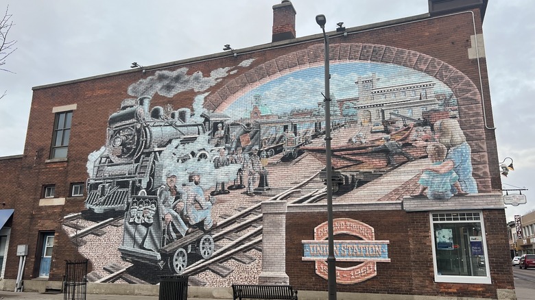 Street mural depicting locomotive and rail workers on Grand Trunk Union Station in Pembroke, Ontario