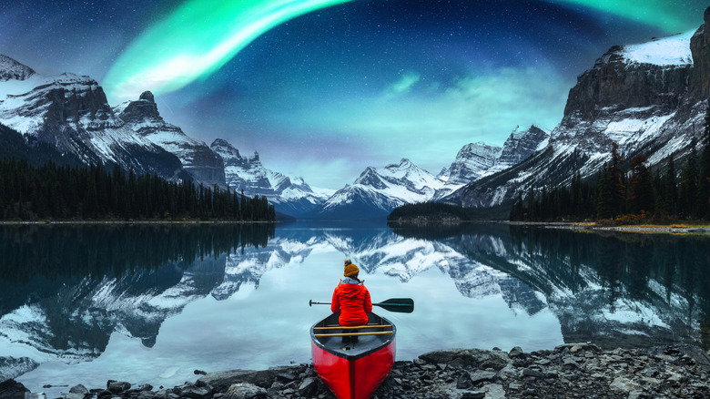 A lake view during the aurora borealis in Jasper, Alberta, Canada
