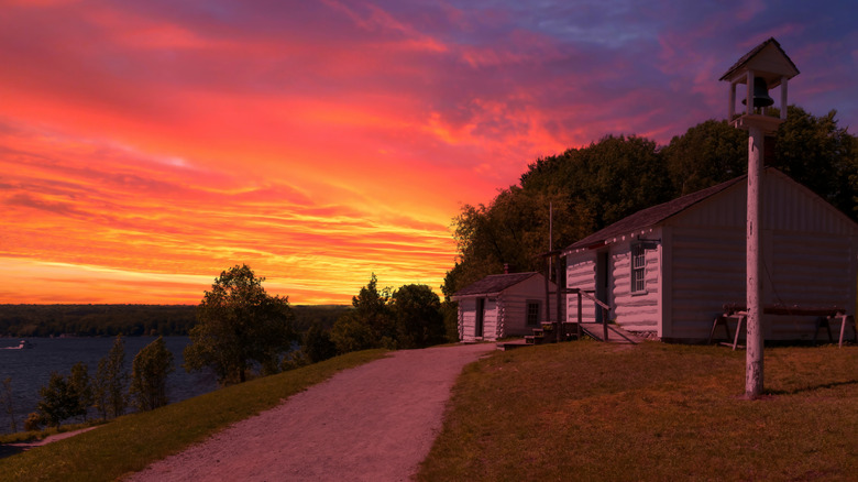 The sun sets on a historic building in Penetanguishene.