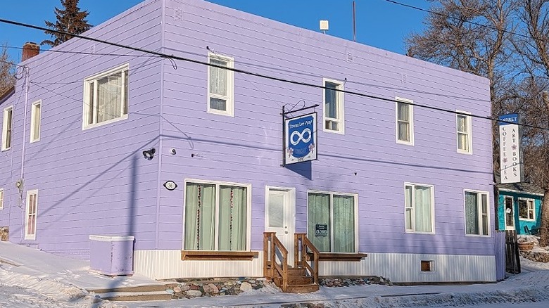 The lavender timber facade of Lebret Cafe.