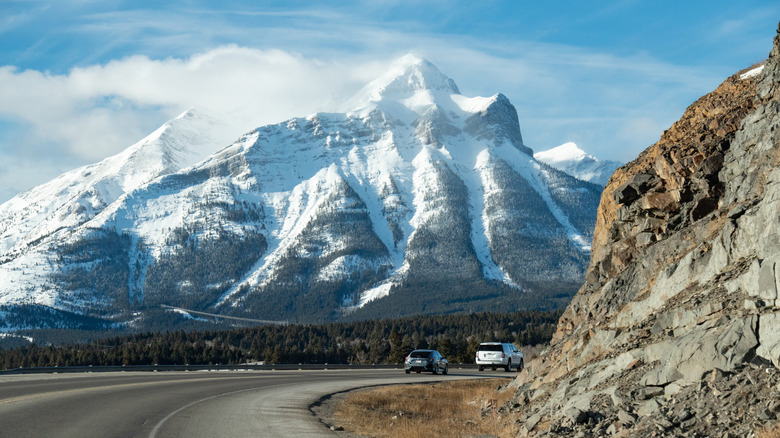 A snow-covered mountain lines the Crowsnest Pass along the Crowsnest Highway