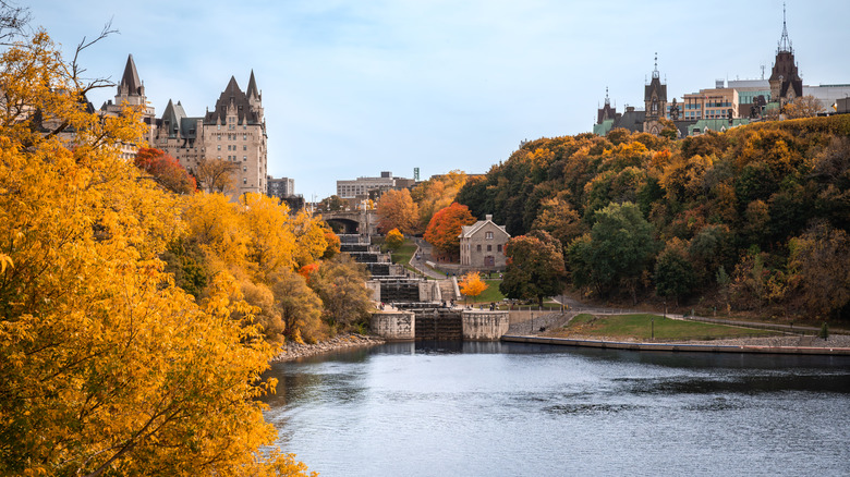 Rideau canal and locks in downtown Ottawa surrounded by fall colors