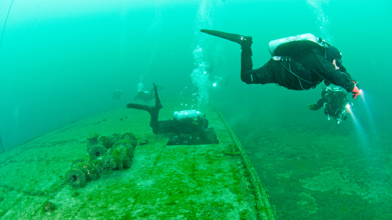 Scuba divers at an underwater site in Ontario, Canada