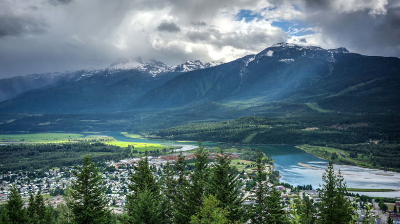 Mountains and forests rise around the town of Revelstoke, BC