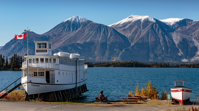 One of the lake steamers docked in front of Atlin's mountains
