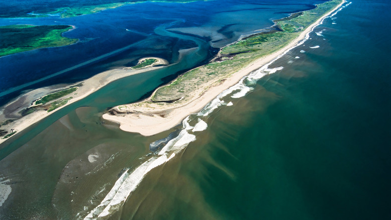Strips of sandy beach and land between water and lagoon at Kouchibouguac National Park