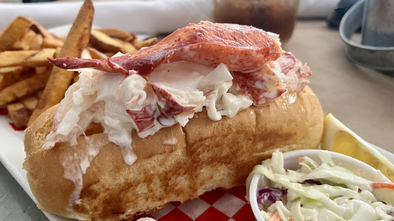 Lobster roll served with fries and coleslaw