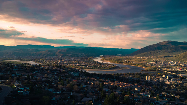 The Thompson River winding its way through the city of Kamloops at dusk