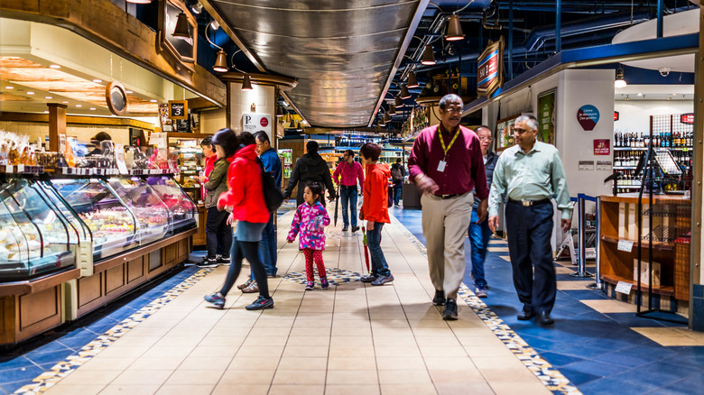 People walking past restaurants and bakeries in the Undergound City in Montreal, Canada