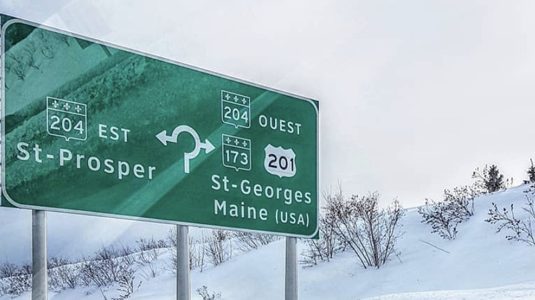 Road sign in Quebec between Saint-Georges and Maine