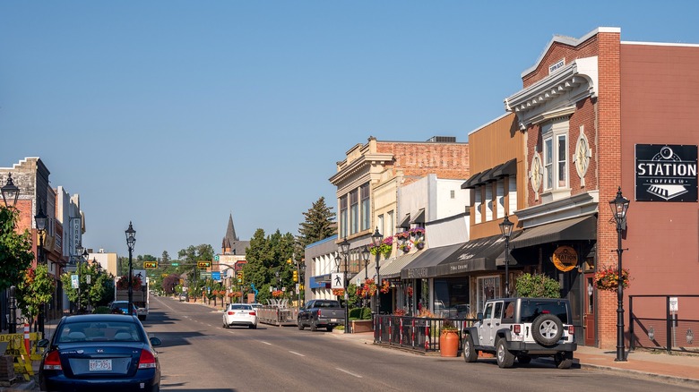 Looking down a downtown street lined with shops in older buildings