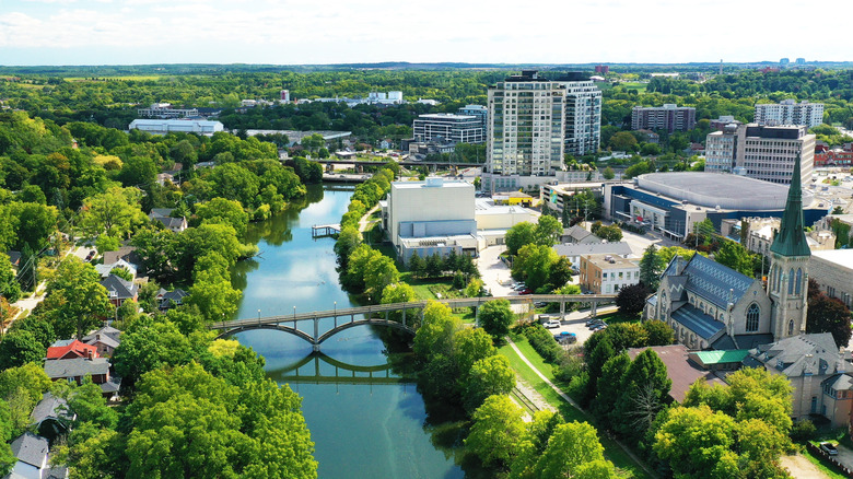 Aerial view of Guelph, Ontario with river, bridge, and buildings