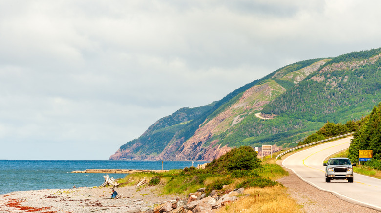 A view of the winding Cabot trail near the water on Cape Breton Island, Nova Scotia