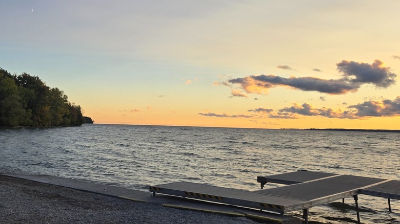 Lake Simcoe at sunset, with a L-shaped dock extending into the water, McRae Point Provincial Park, Ontario, Canada