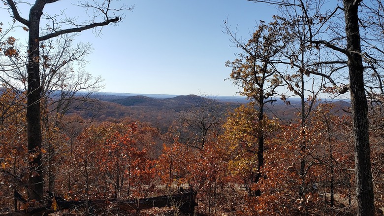 Fall views of trail and mountain peaks at Caney Mountain Conservation Area in Missouri