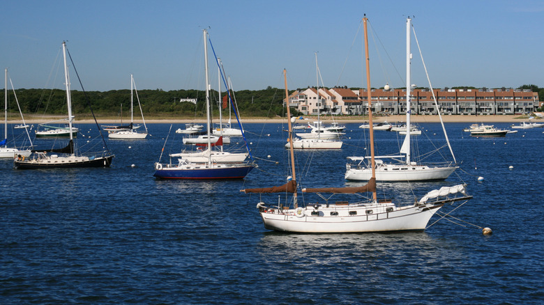 Boats on the water in Hyannis Harbor and beachside resort.