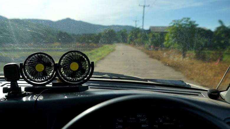 Portable car fans on dashboard