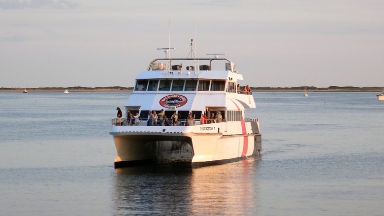 A ferry chugs across Cape Cod Bay at magic hour