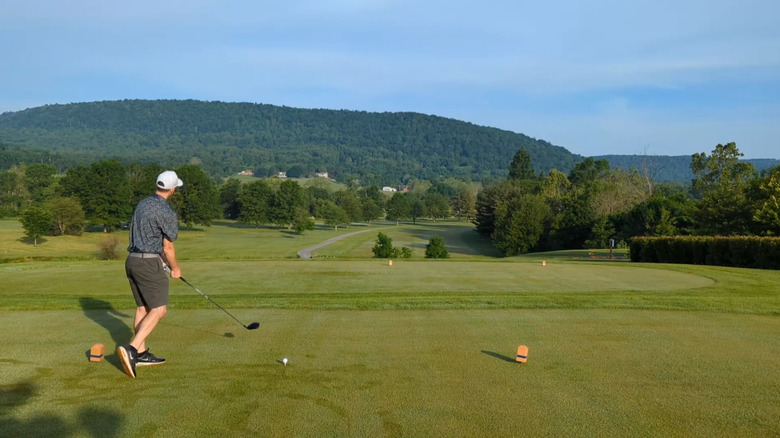 Golfer about to hit a ball at Carroll Valley Golf Course