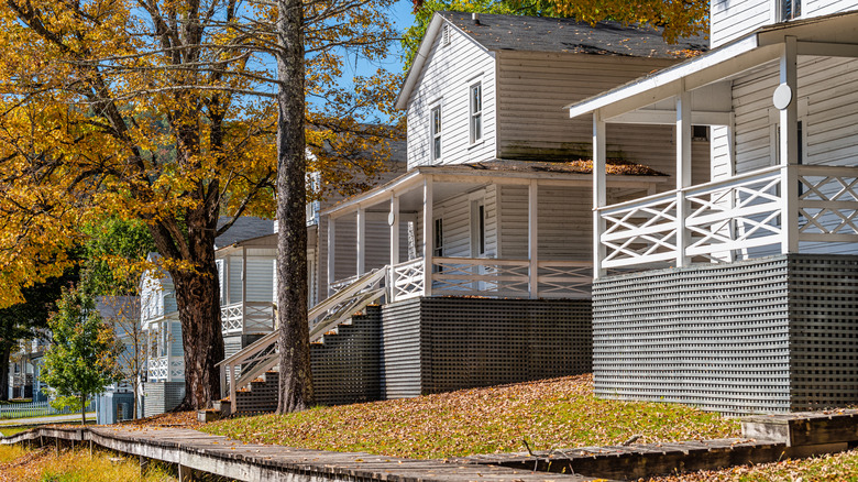 Row of old white houses, part of the company town in Cass, West Virginia
