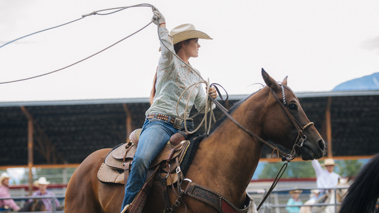 Rodeo cowgirl in action