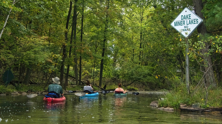 People kayaking on lake in Waupaca