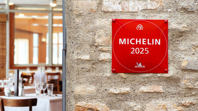 Red Michelin plaque affixed on a restaurant wall