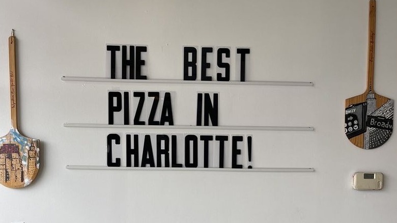 Sign at Why Not Pizza in Charlotte, North Carolina