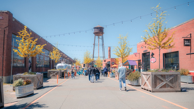 Pedestrians and shops in Charlotte's Camp North End