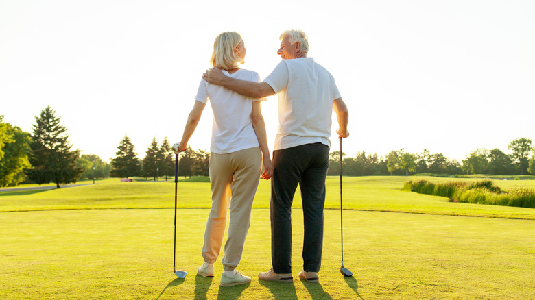Senior couple on golf course
