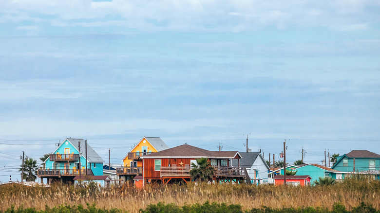 Colorful stilt beach homes at Surfside Beach, Texas.