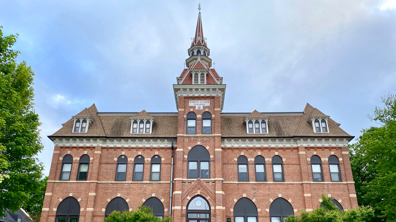 A large red-brick building with a tower located in New Ulm, Minnesota