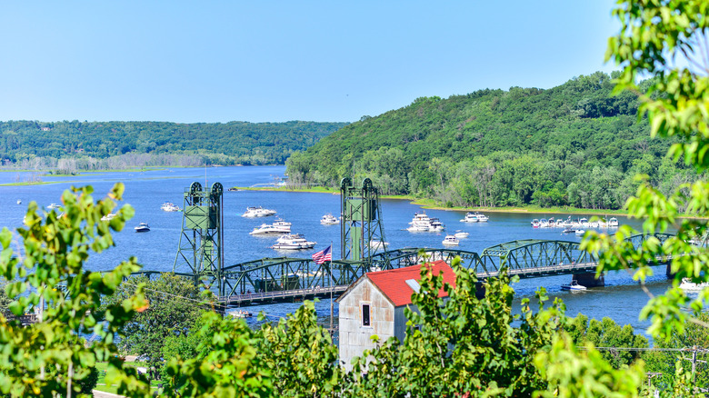 The historic lift bridge in Stillwater, Minnesota along the St. Croix River surrounded by greenery