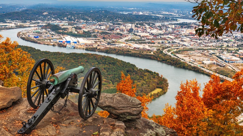 The overlook of Point Park with a canon in the foreground, and a river and city in the background