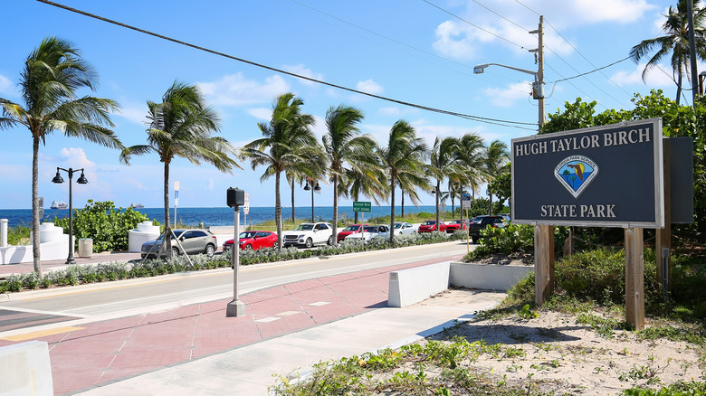 The Hugh Taylor Birch State Park sign across from the beach