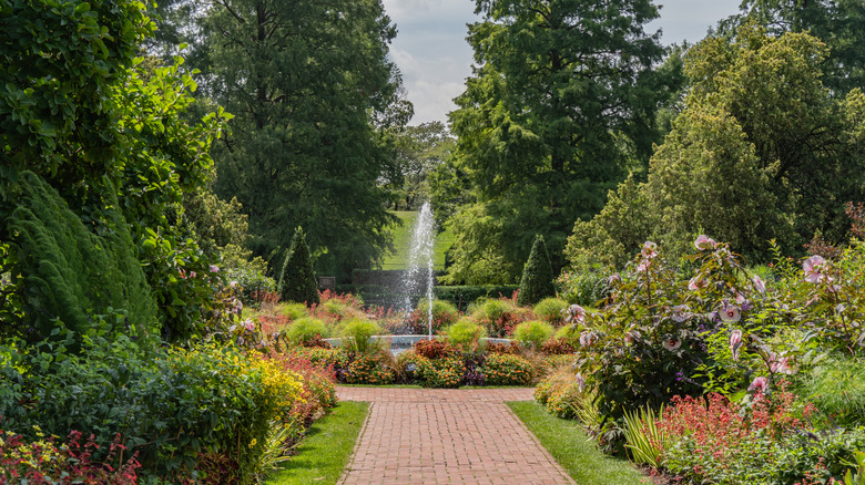 View of fountain surrounded by flower beds and landscaping at Longwood Gardens, Pennsylvania.