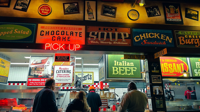 restaurant pickup counter in Chicago with menu signs
