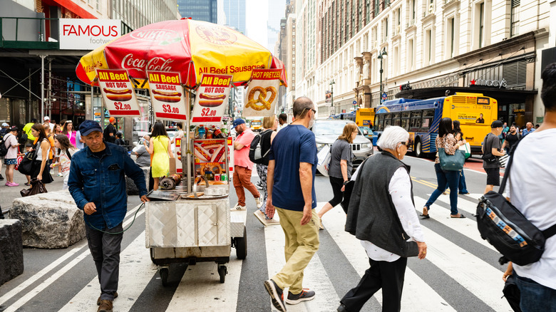 A hot dog cart at an intersection in New York City