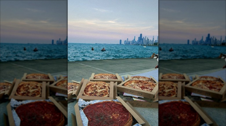 Art of pizza pies in the foreground, skyline in the background