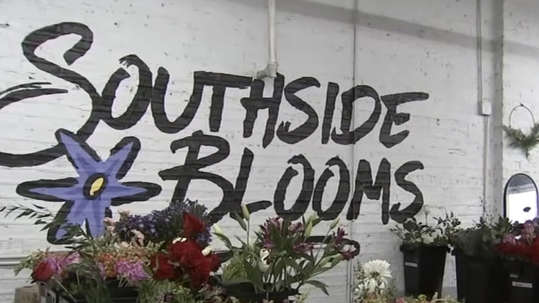 Southside Blooms painted in black on the wall of the flower shop