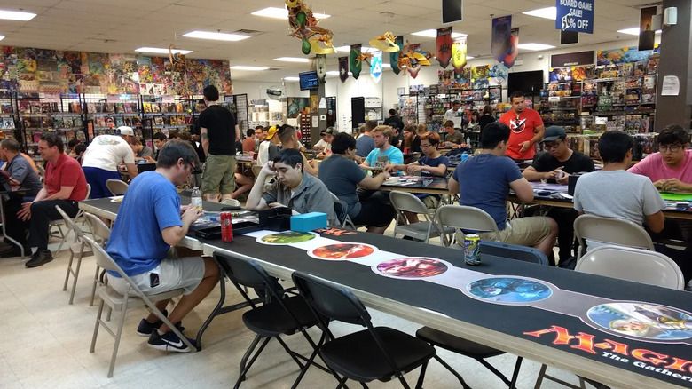 Customers playing board games at Pastimes Comics and Games in Niles, Illinois