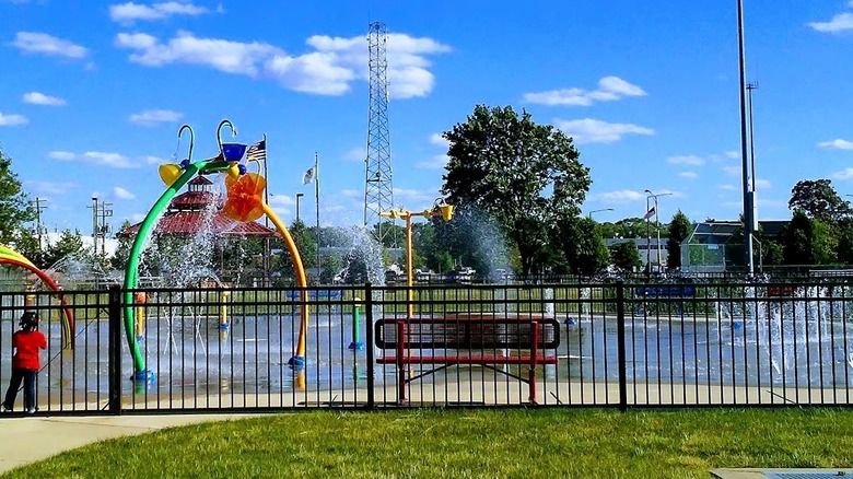 Little girl looking at splash pad at Stevenson Park in Bellwood, Illinois