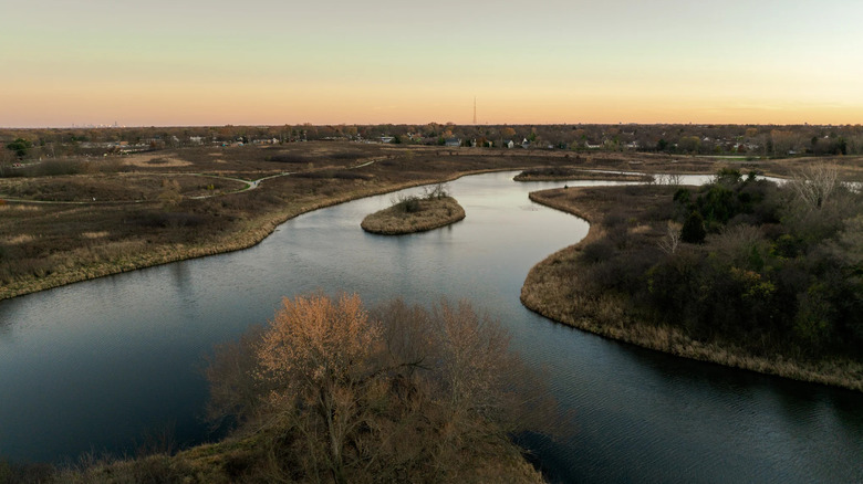 Aerial view of creek in Buffalo Creek Forest Preserve at sunset